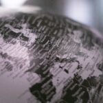 grayscale photo of desk globe